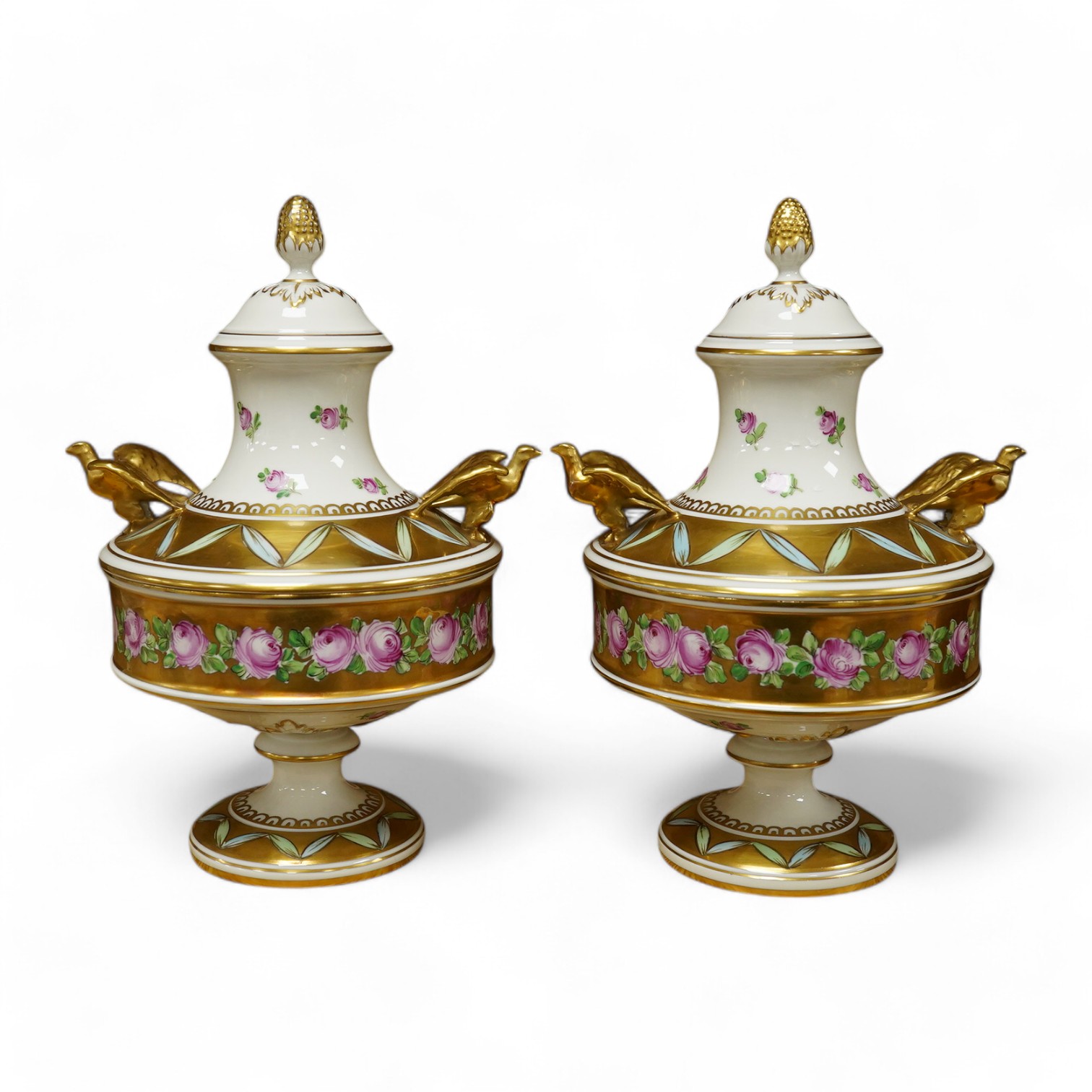 A pair of Dresden porcelain vases/urns, hand painted and gilded, numbered 11914 to the base, 24cm high. Condition - good